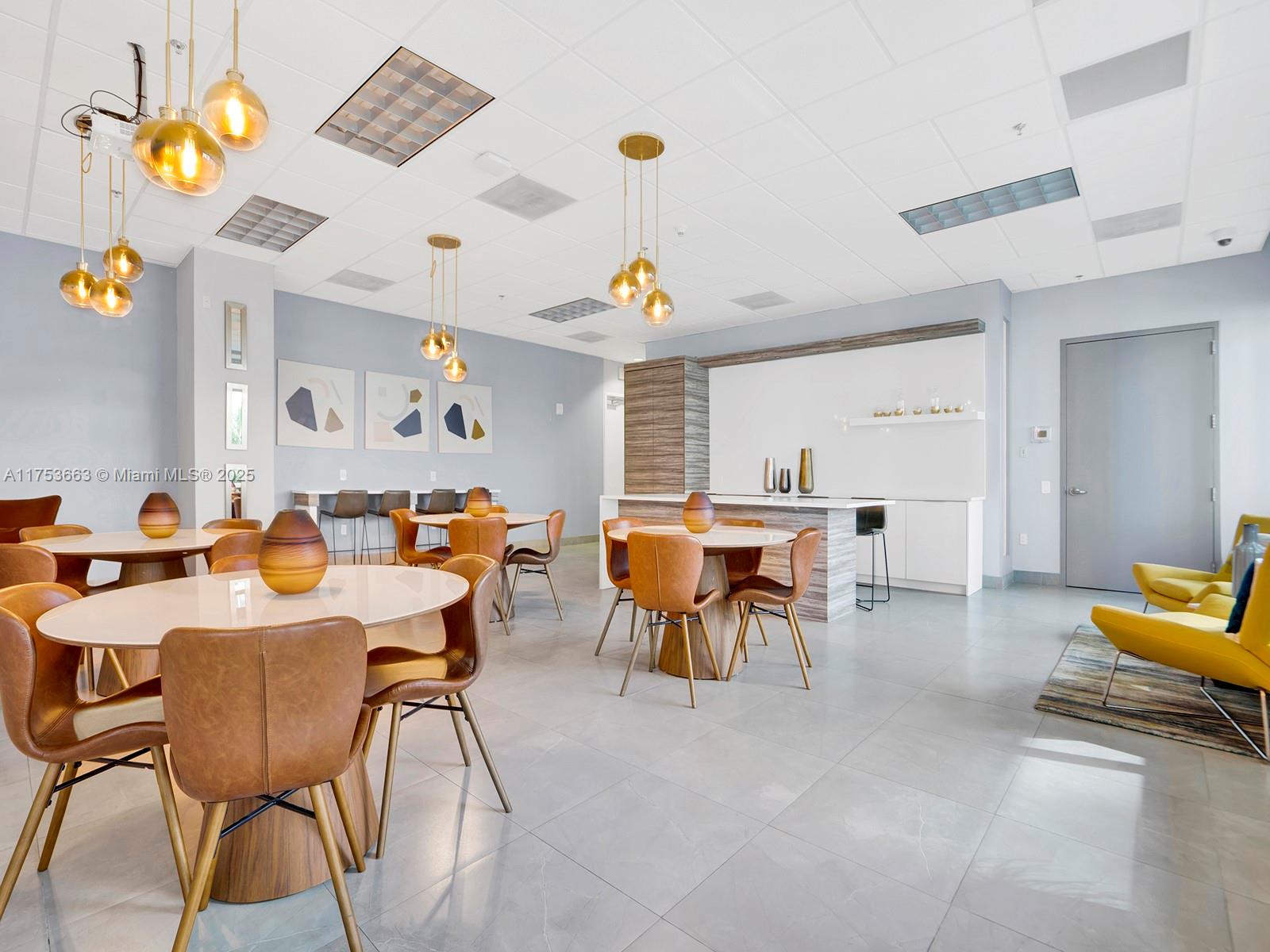 1200 Brickell Bay Drive, Unit 4019 Miami, FL 33131 - Photo 29 of 32 a view of a dining room with furniture and chandelier