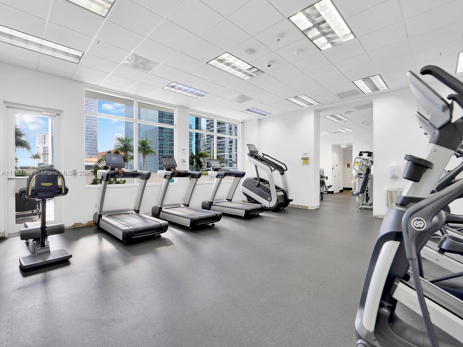 1200 Brickell Bay Drive, Unit 4019 Miami, FL 33131 - Photo 30 of 32 a view of a room with gym equipment