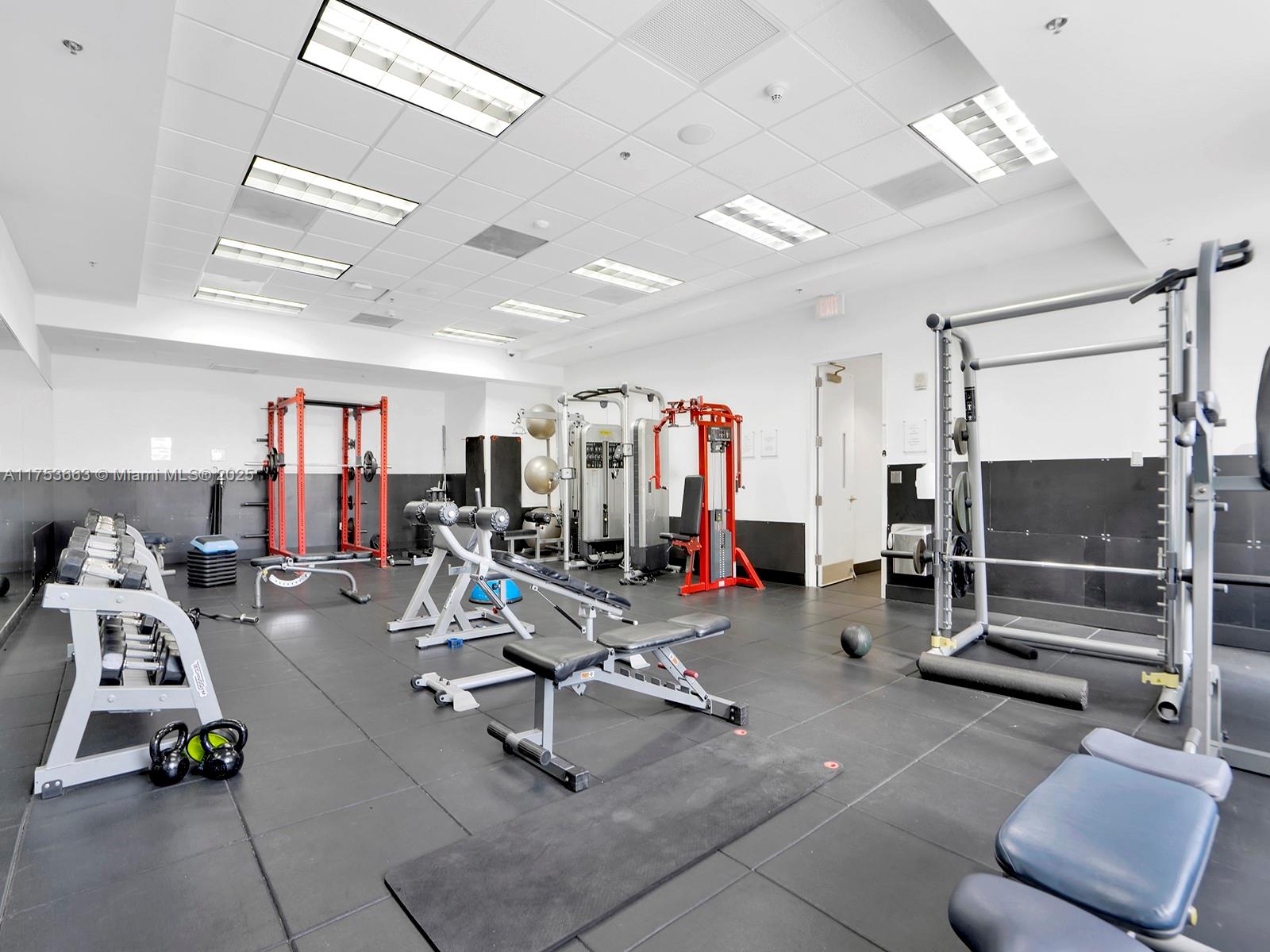 1200 Brickell Bay Drive, Unit 4019 Miami, FL 33131 - Photo 31 of 32 a view of a room with gym equipment