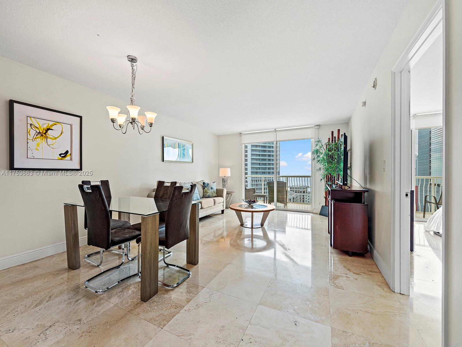 1200 Brickell Bay Drive, Unit 4019 Miami, FL 33131 - Photo 5 of 32 a view of a dining room with furniture window and outside view