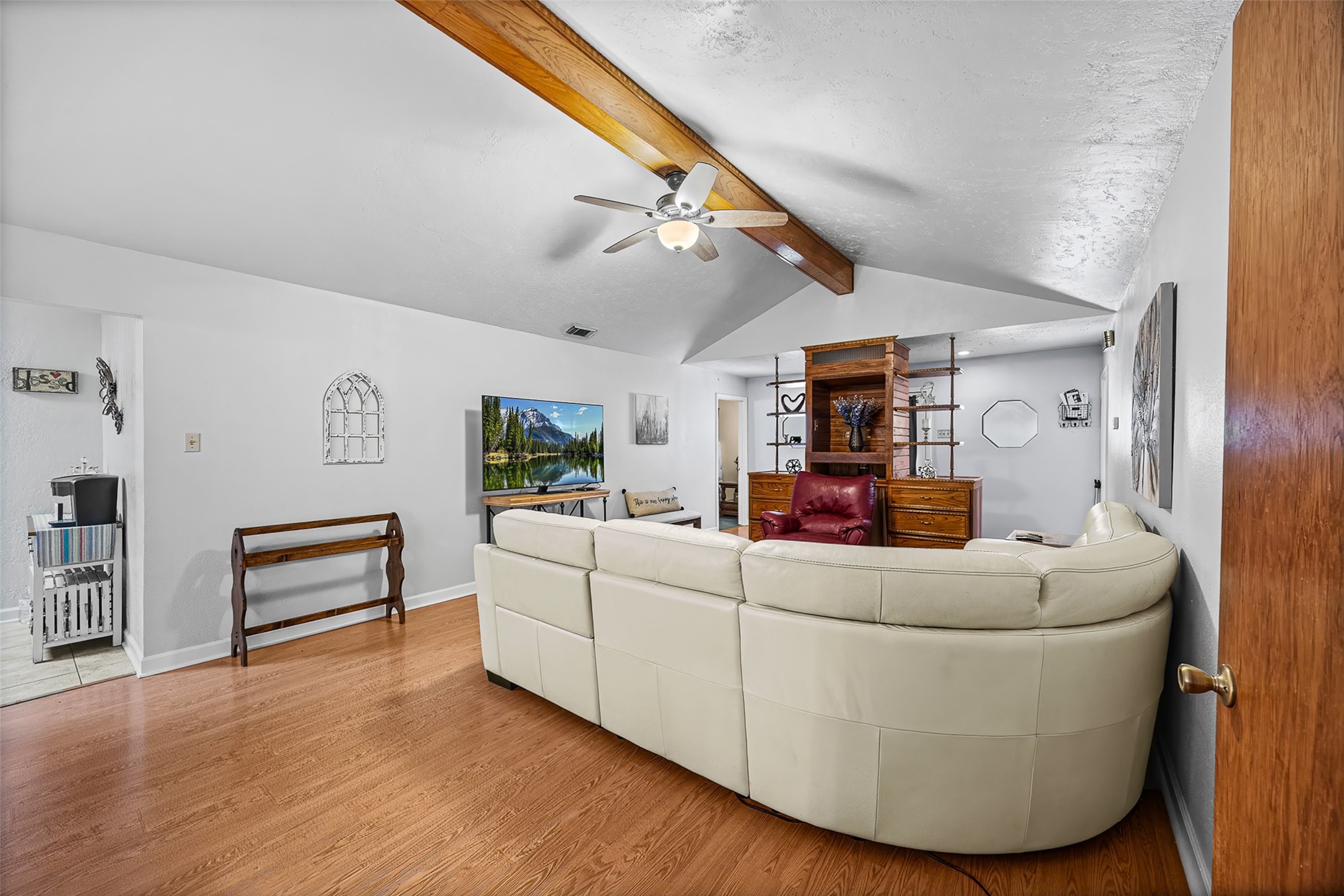 2519 Wood River Road Spring, TX 77373 - Photo 8 of 26 a living room with furniture and a wooden floor