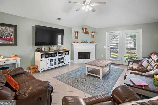 a living room with furniture and a flat screen tv