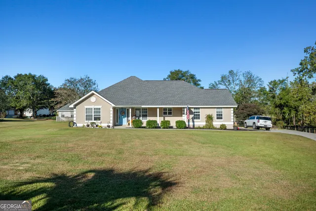 front view of a house with a yard