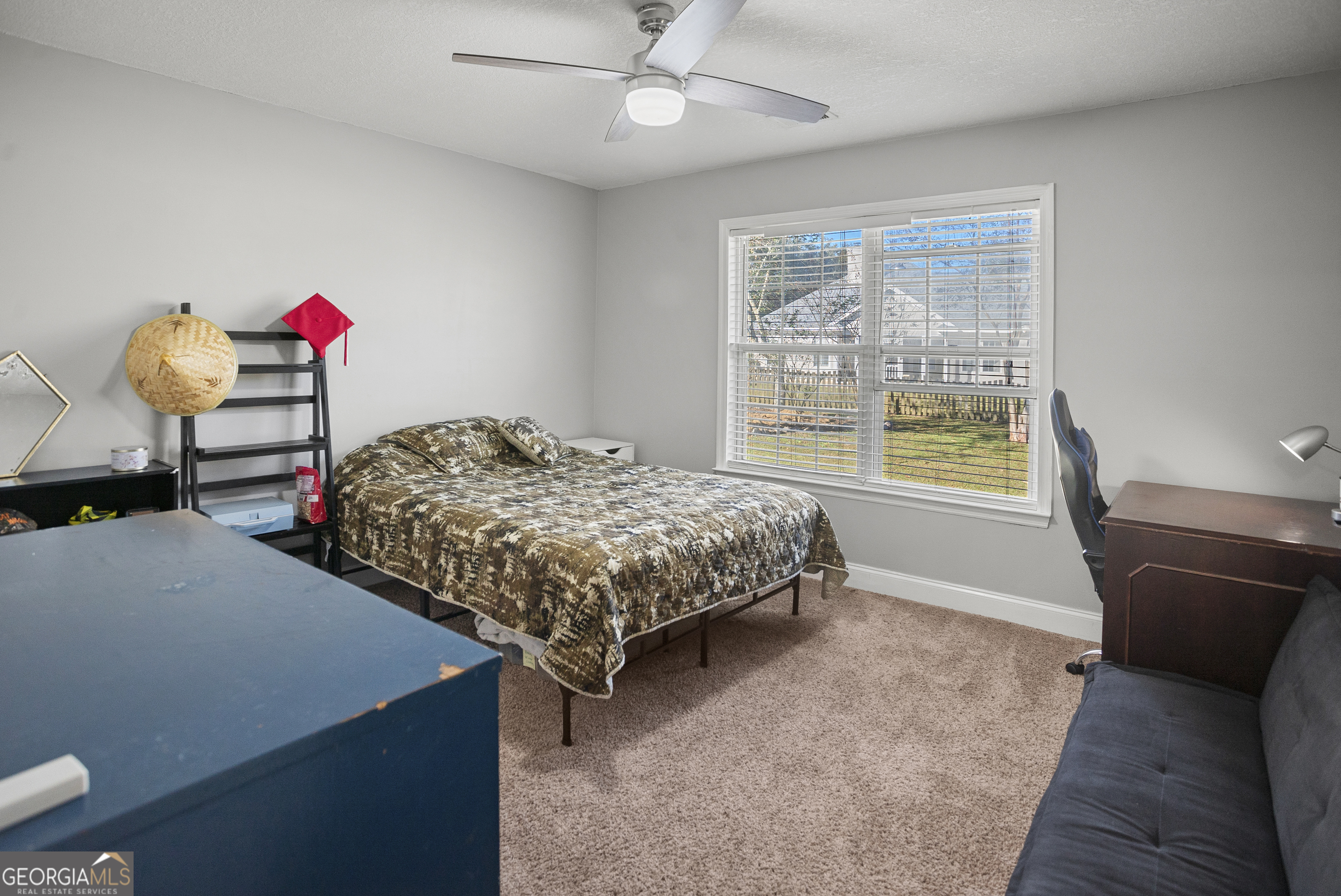 29 Sterling Court Ellabell, GA 31308 - Photo 23 of 40 a bedroom with a bed and a chandelier