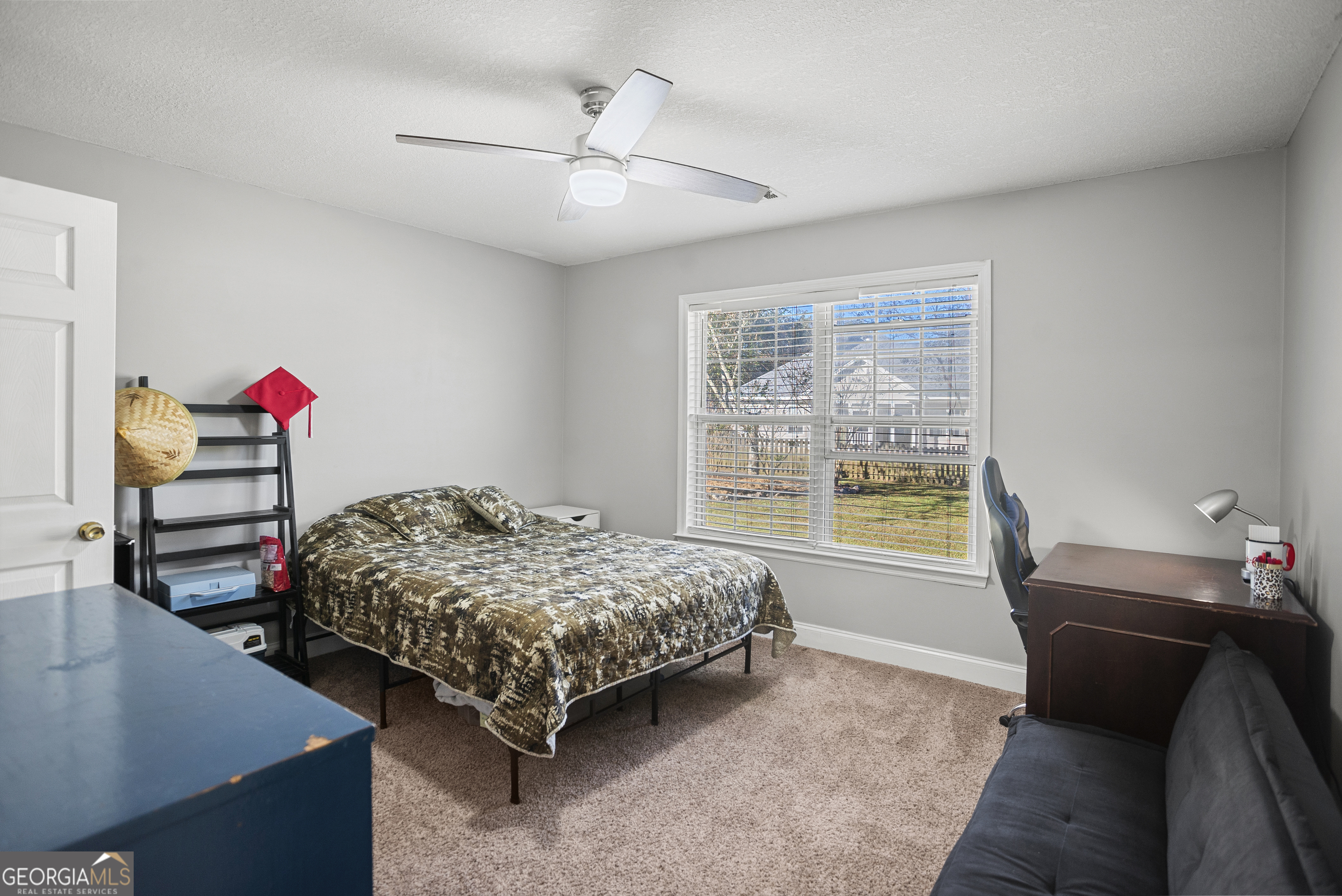 29 Sterling Court Ellabell, GA 31308 - Photo 24 of 40 a bedroom with a bed and a chandelier