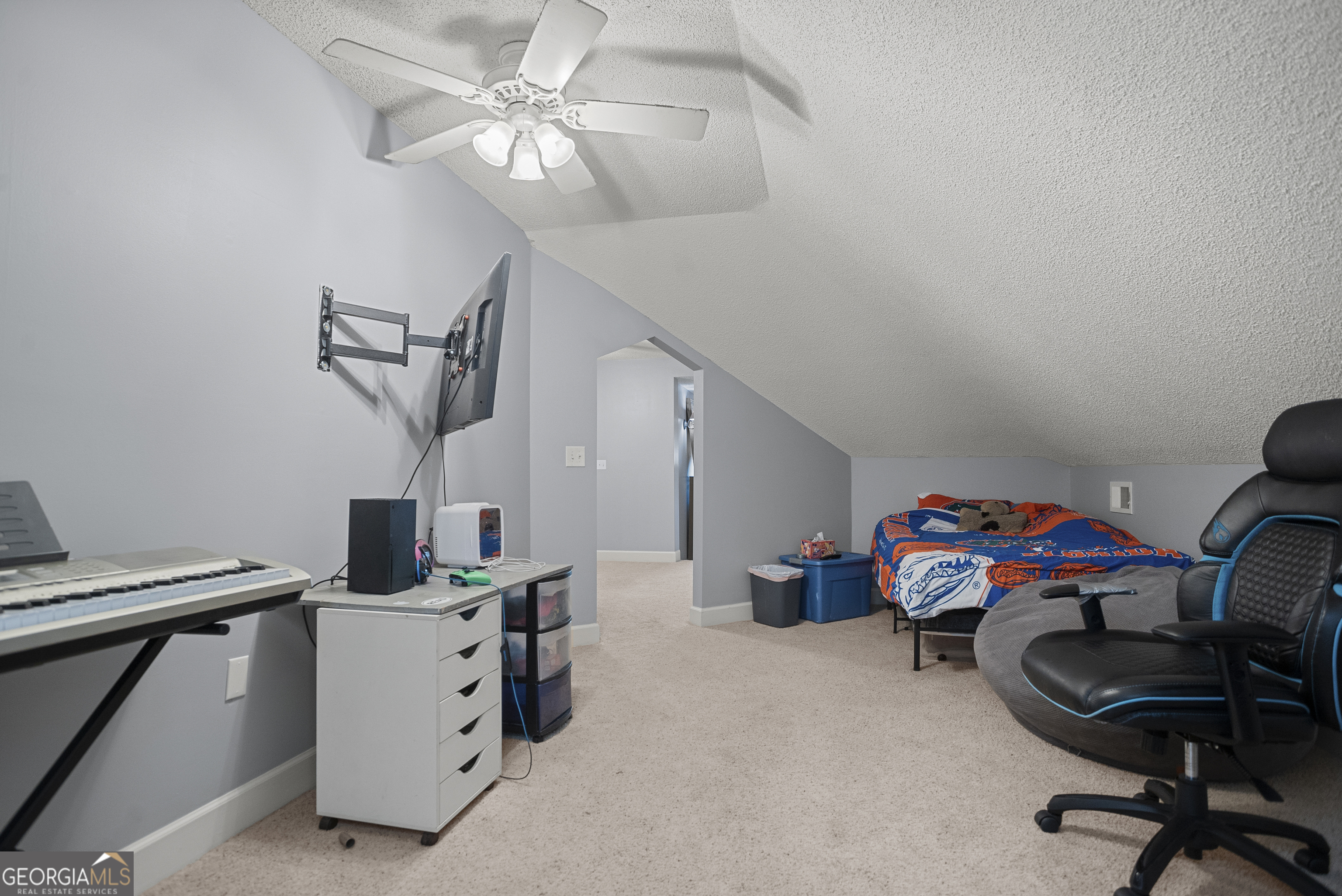 29 Sterling Court Ellabell, GA 31308 - Photo 30 of 40 a utility room with furniture and a ceiling fan