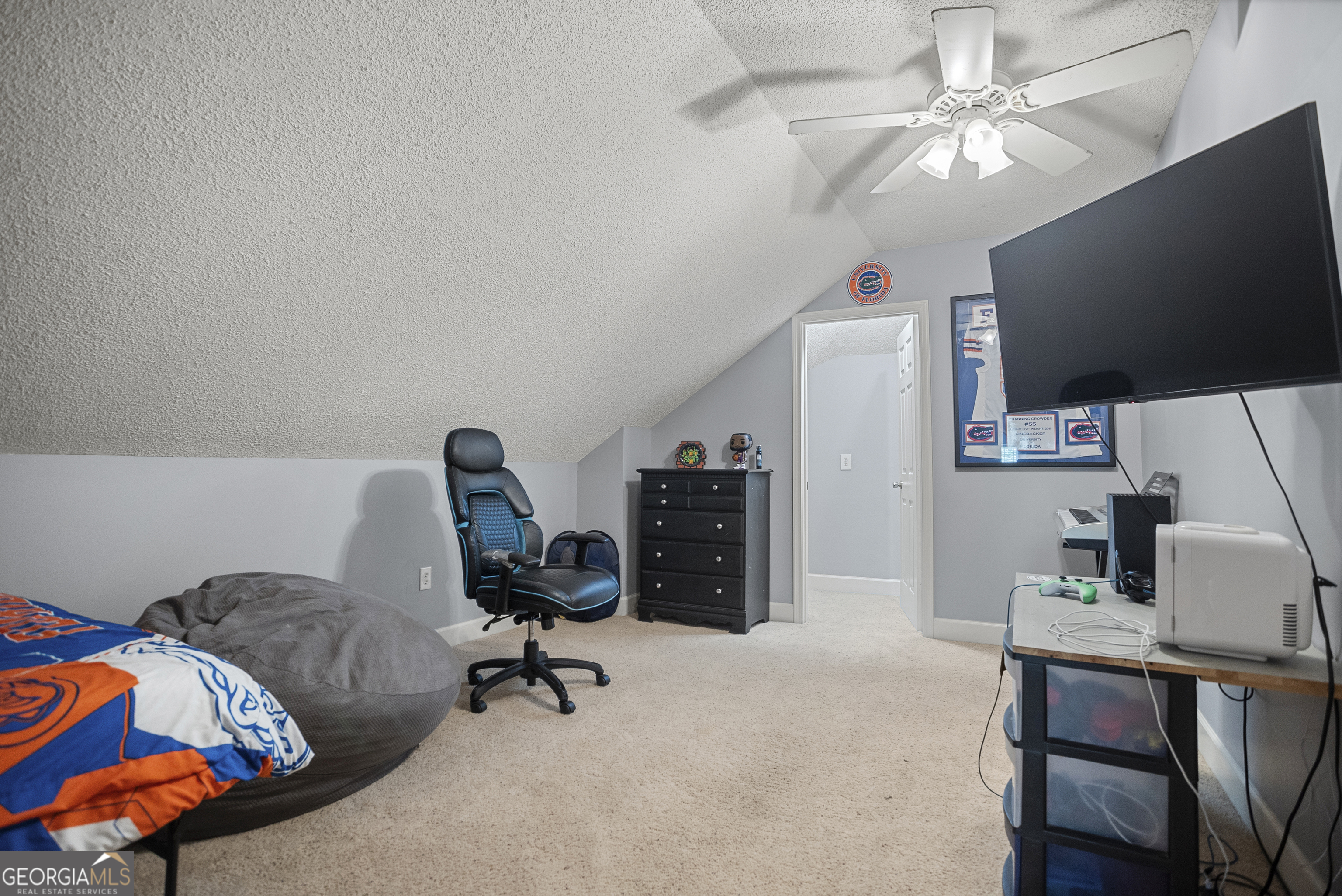 29 Sterling Court Ellabell, GA 31308 - Photo 31 of 40 a view of a workspace with furniture and a flat screen tv
