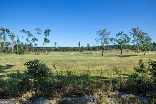 a view of a lake with a big yard