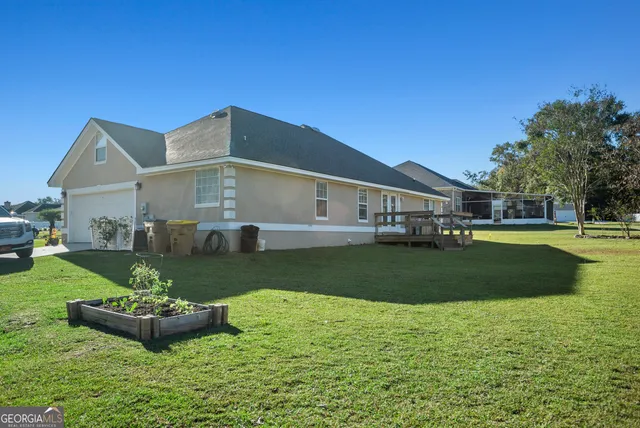 a front view of a house with a yard table and chairs