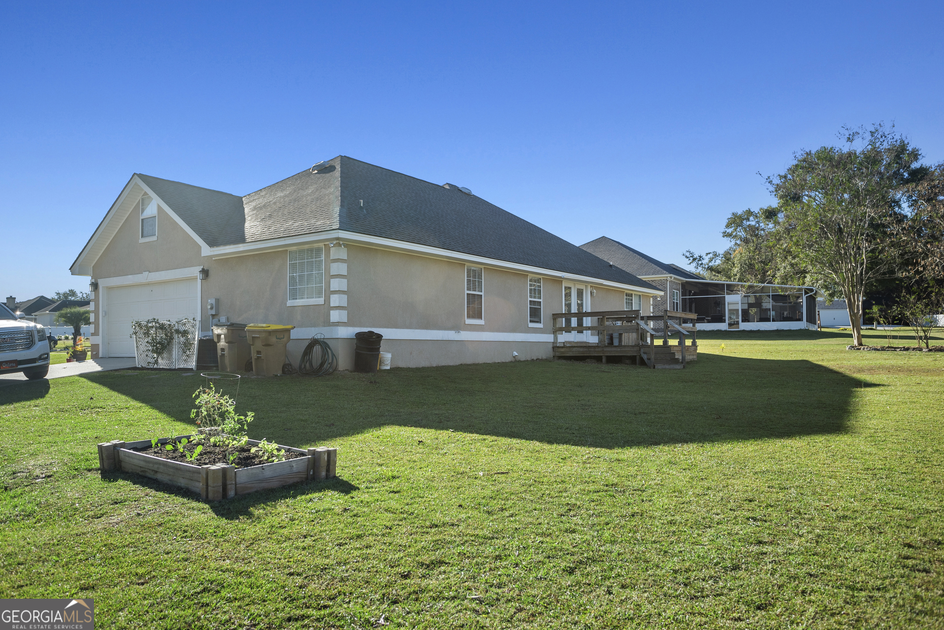 29 Sterling Court Ellabell, GA 31308 - Photo 4 of 40 a front view of a house with a yard table and chairs