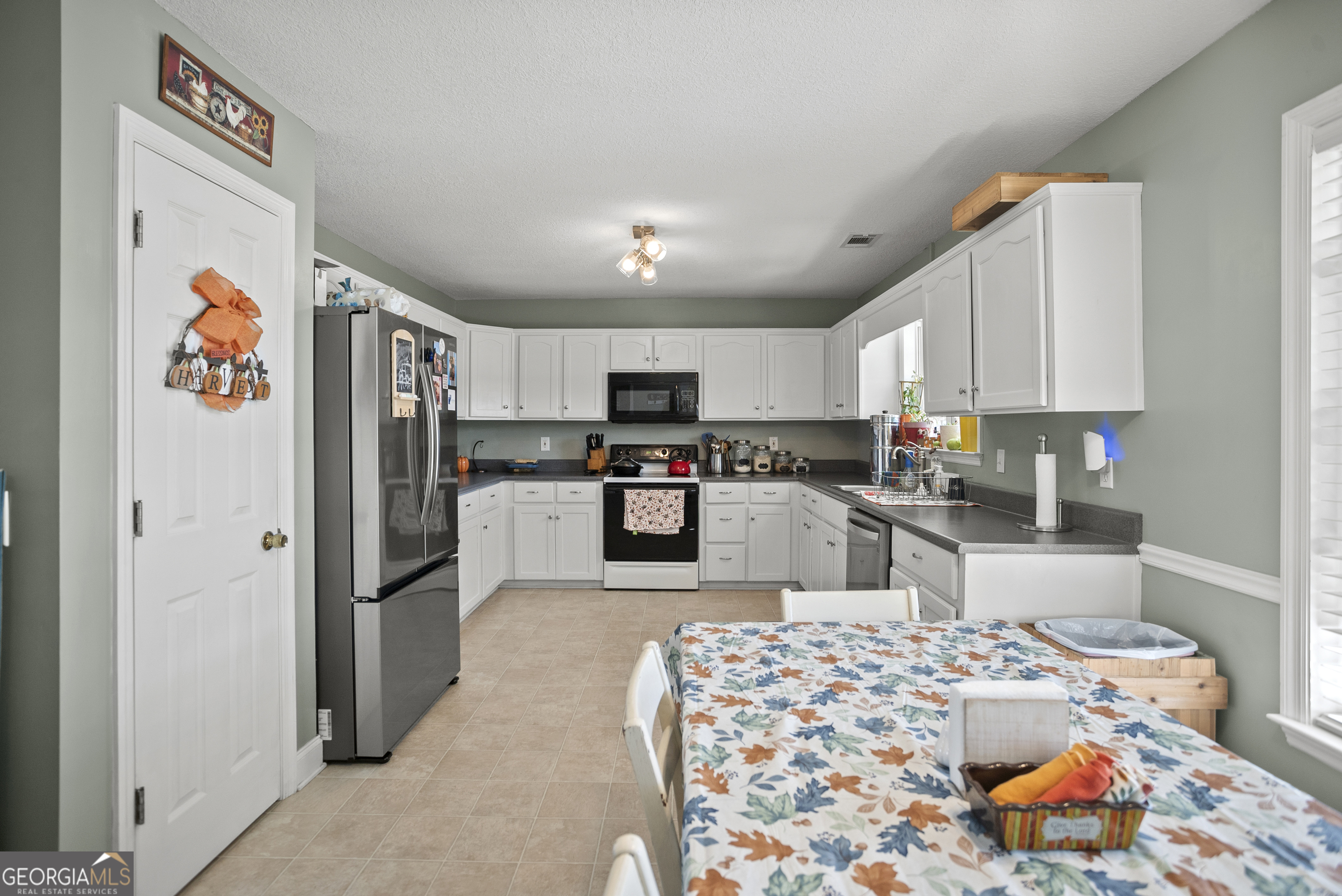 29 Sterling Court Ellabell, GA 31308 - Photo 8 of 40 a kitchen with stainless steel appliances granite countertop a refrigerator and a stove top oven