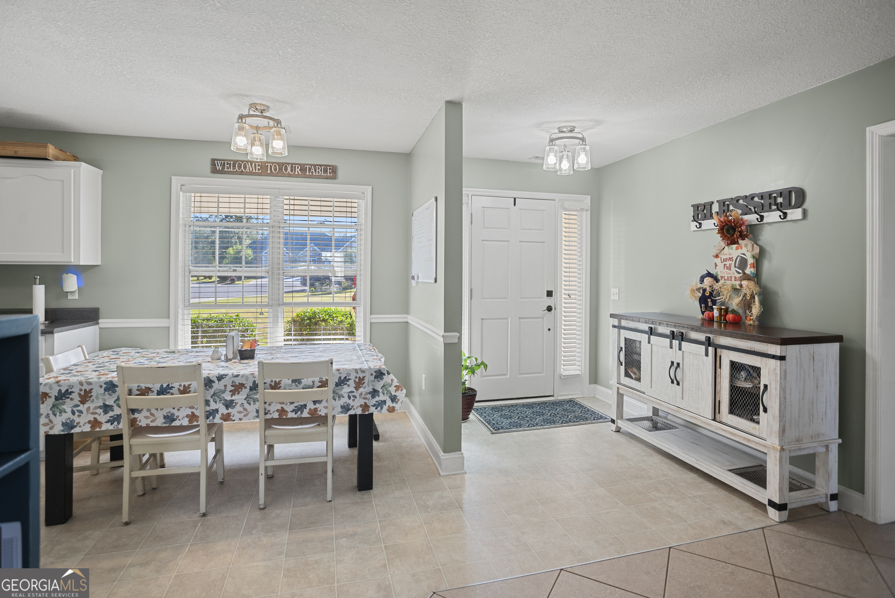 29 Sterling Court Ellabell, GA 31308 - Photo 10 of 40 a view of a dining room with furniture and chandelier