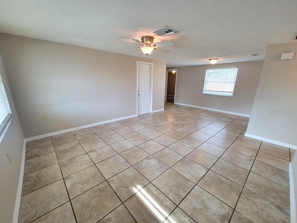 7335 Castanea Drive Port Richey, FL 34668 - Photo 4 of 20 a view of a livingroom with a white umbrella