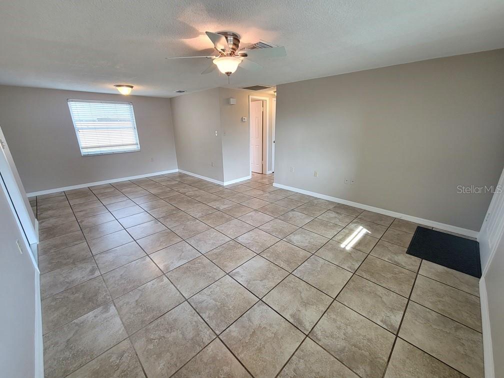 7335 Castanea Drive Port Richey, FL 34668 - Photo 5 of 20 a view of an empty room and window
