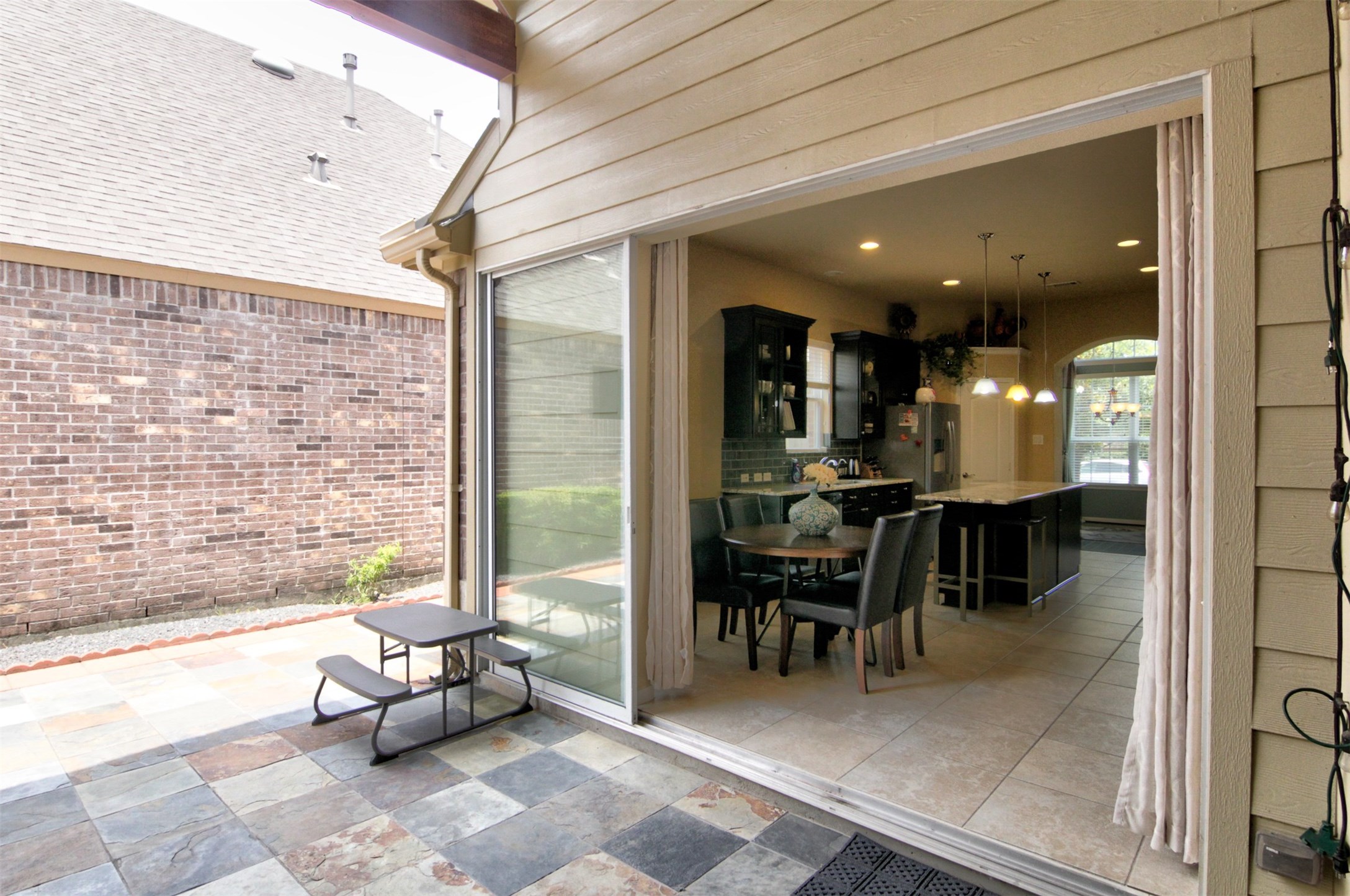 1423 Ralston Branch Way Sugar Land, TX 77479 - Photo 17 of 43 soak in the sun and enjoy magical evenings in large, covered back patio paved in slate tiles