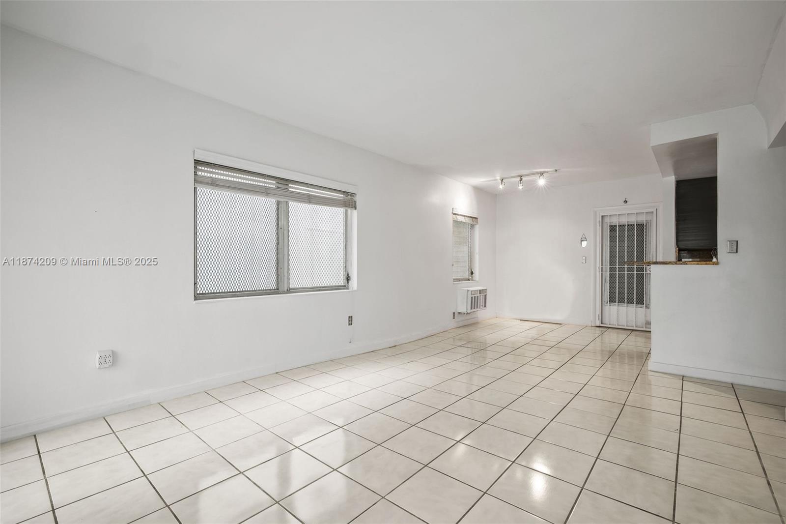 641 Española Way, Unit 3 Miami Beach, FL 33139 - Photo 15 of 23 a view of an empty room and a window