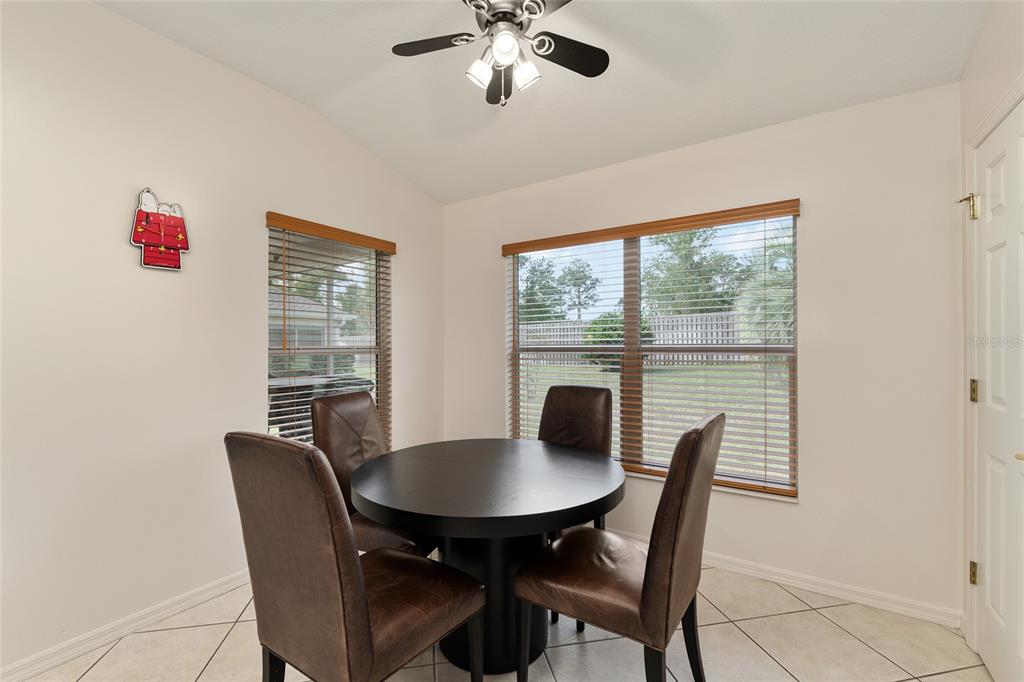 9063 Southeast 120th Loop Summerfield, FL 34491 - Photo 26 of 90 a view of a dining room with furniture window and outside view