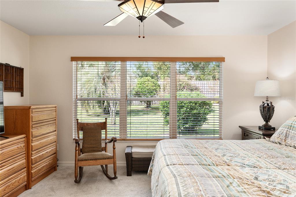 9063 Southeast 120th Loop Summerfield, FL 34491 - Photo 29 of 90 a bedroom with a bed and a television