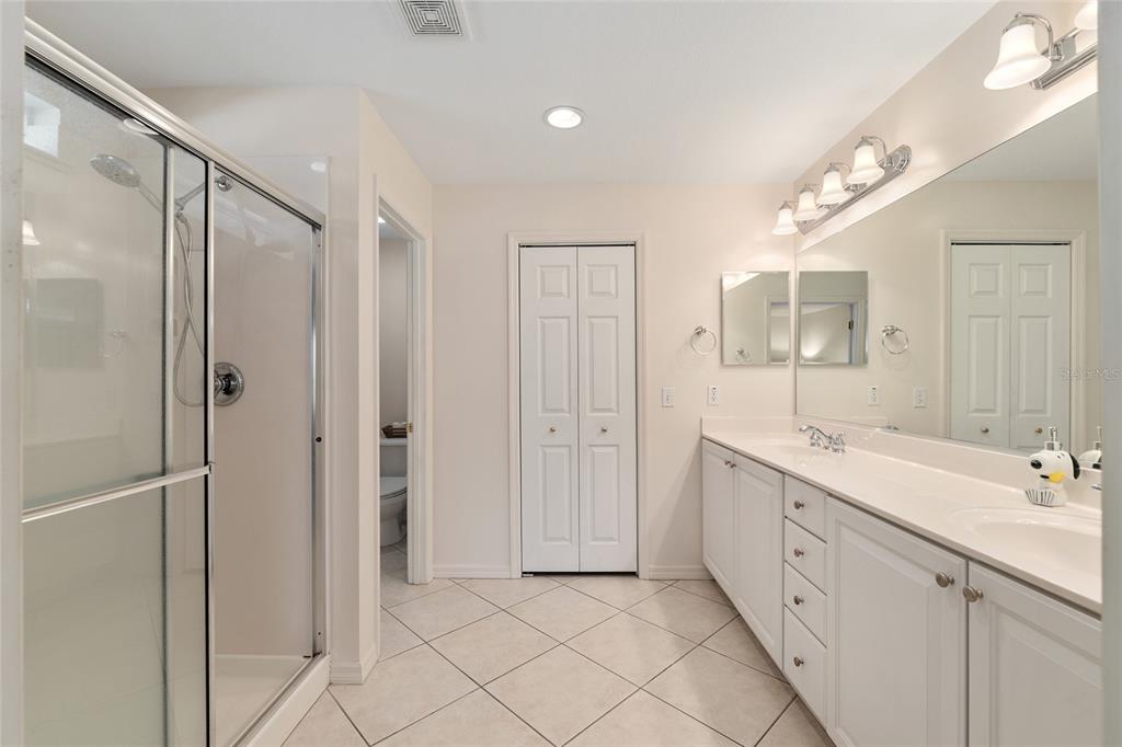 9063 Southeast 120th Loop Summerfield, FL 34491 - Photo 31 of 90 a spacious bathroom with a double vanity sink mirror and double