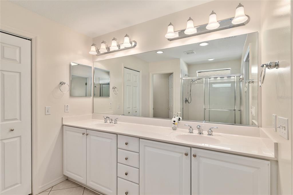 9063 Southeast 120th Loop Summerfield, FL 34491 - Photo 32 of 90 a bathroom with a sink double vanity and a mirror