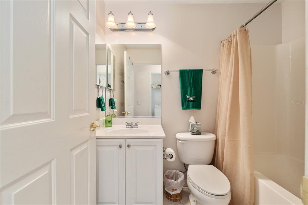 9063 Southeast 120th Loop Summerfield, FL 34491 - Photo 40 of 90 a bathroom with a toilet sink and mirror