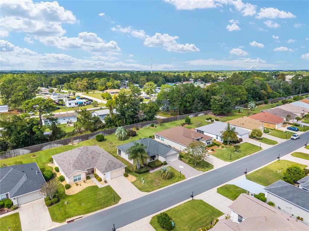 9063 Southeast 120th Loop Summerfield, FL 34491 - Photo 56 of 90 a view of an outdoor space patio swimming pool and outdoor seating
