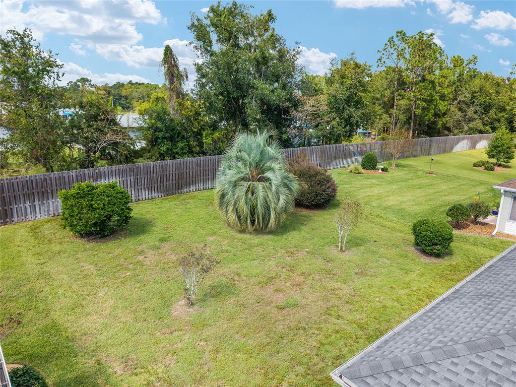 9063 Southeast 120th Loop Summerfield, FL 34491 - Photo 60 of 90 a view of a garden with a slide