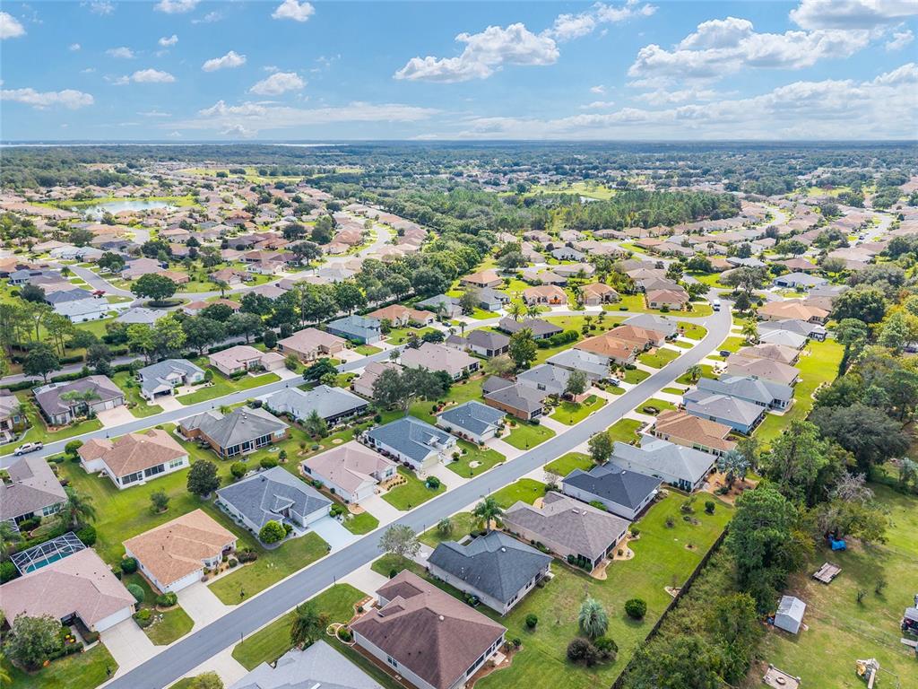 9063 Southeast 120th Loop Summerfield, FL 34491 - Photo 67 of 90 an aerial view of residential houses with outdoor space