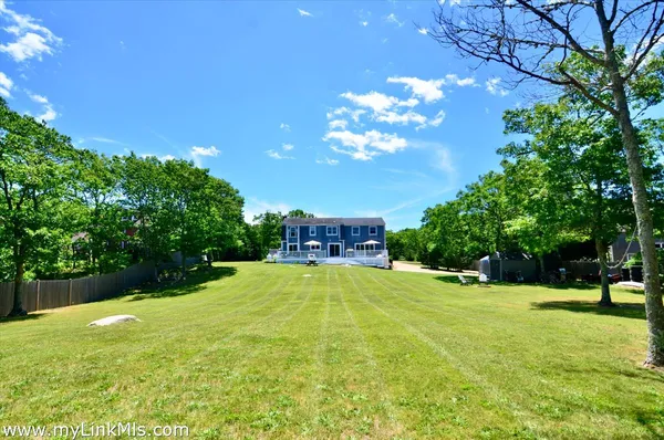 a view of a house with swimming pool and sitting area