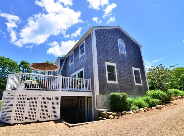a living room with furniture fireplace and window