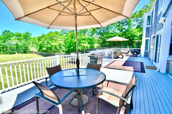 a living room with furniture a fireplace and a window