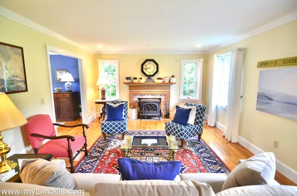 a living room with furniture rug and window