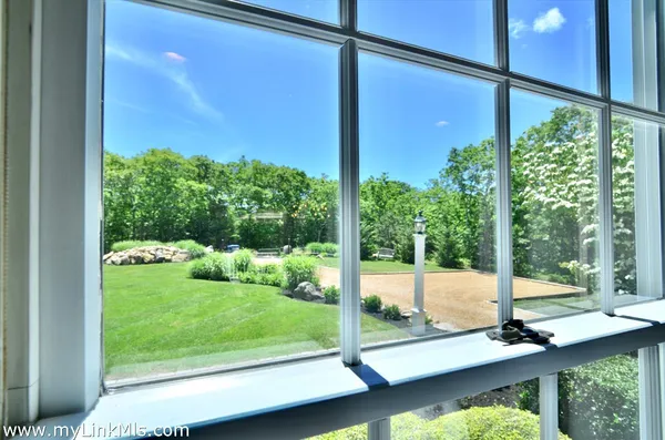 a kitchen with stainless steel appliances a refrigerator and wooden floor
