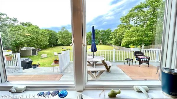 a spacious bedroom with a bed and flat screen tv