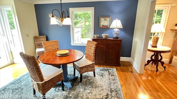 a spacious bedroom with a bed and a lamp