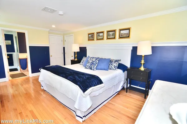 a bathroom with a granite countertop sink toilet and a mirror