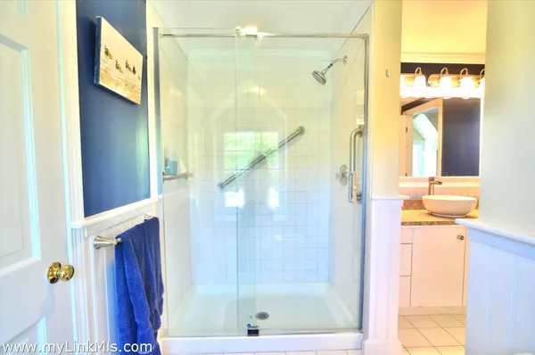 a bed room with a bed and a table