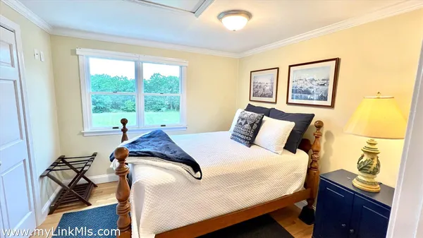 a living room with furniture rug and window