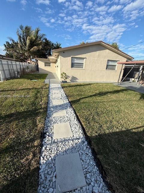 11063 Southwest 5th Street, Unit 11063 Sweetwater, FL 33174 - Photo 19 of 19 a view of a house with a yard