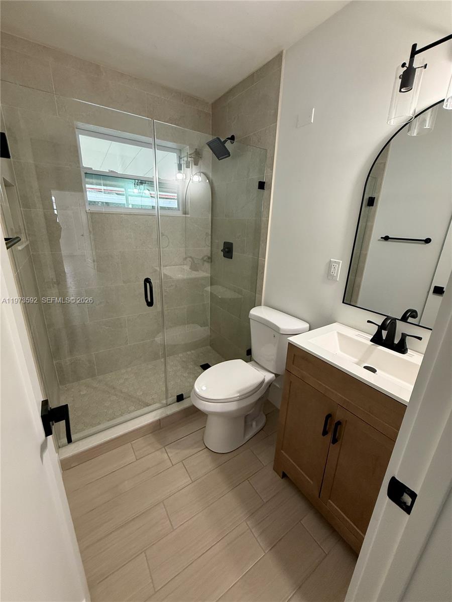 11063 Southwest 5th Street, Unit 11063 Sweetwater, FL 33174 - Photo 5 of 19 a bathroom with a toilet sink and shower