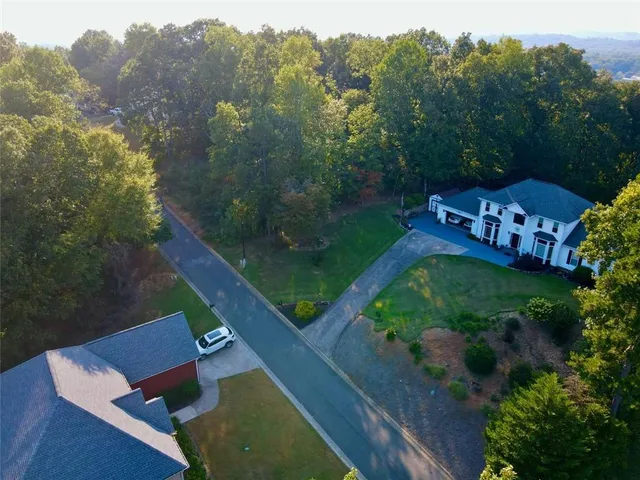 an aerial view of a house with a garden