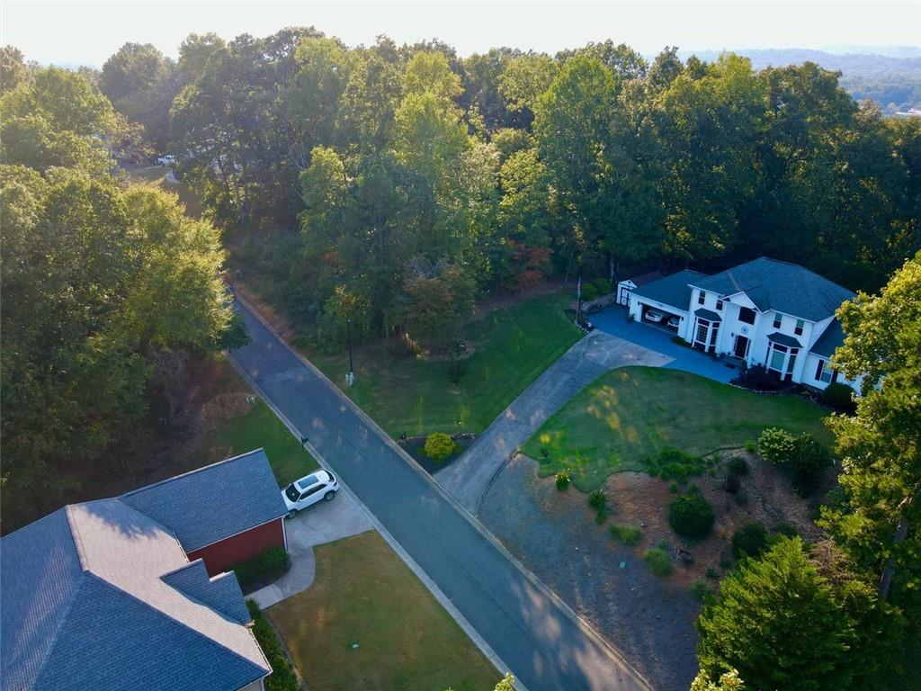an aerial view of a house with a garden