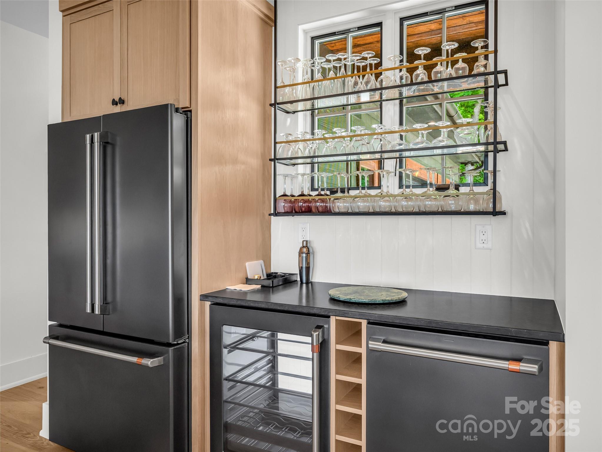 627 Cherry Hill, Unit 201 Mill Spring, NC 28756 - Photo 12 of 48 a kitchen with stainless steel appliances granite countertop a refrigerator and a sink