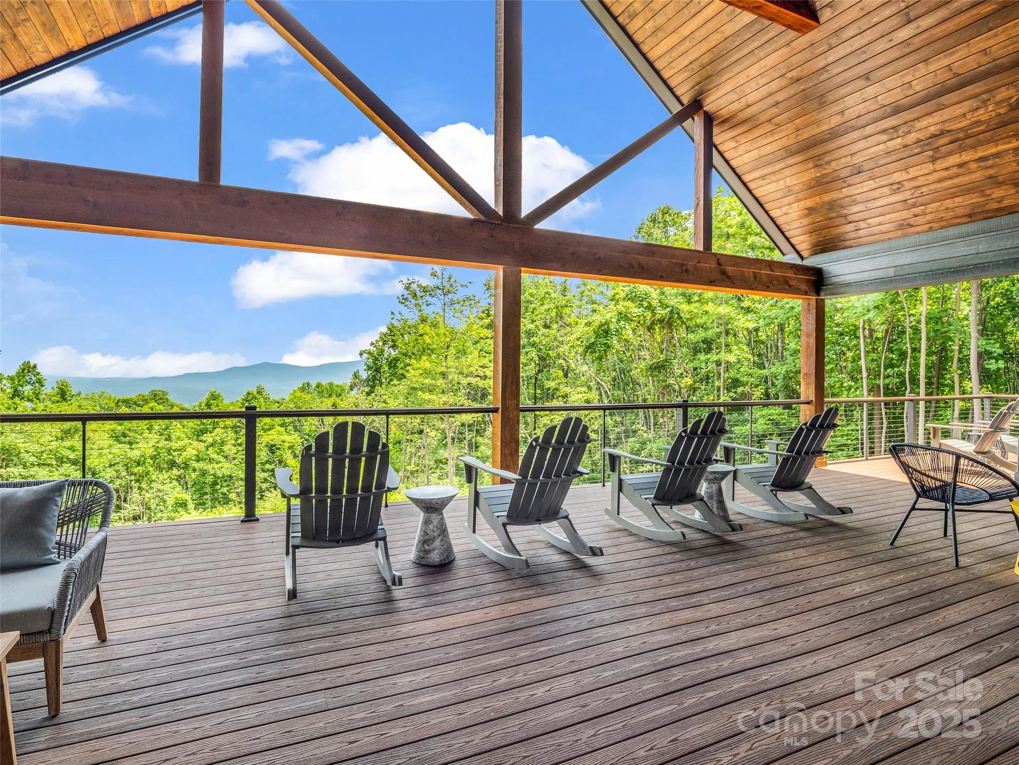 627 Cherry Hill, Unit 201 Mill Spring, NC 28756 - Photo 13 of 48 a view of deck with furniture and wooden floor