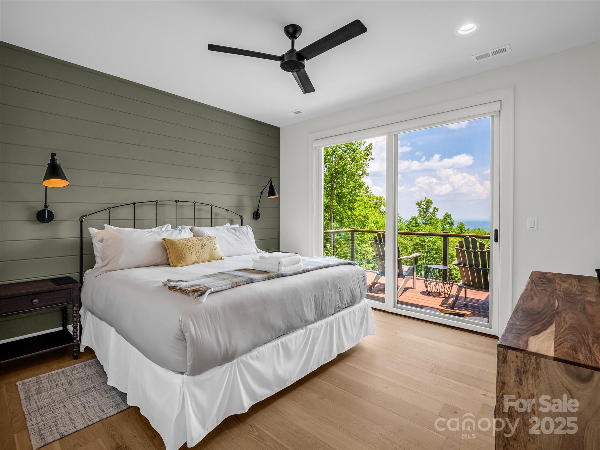 627 Cherry Hill, Unit 201 Mill Spring, NC 28756 - Photo 18 of 48 a bedroom with a large bed and a large window