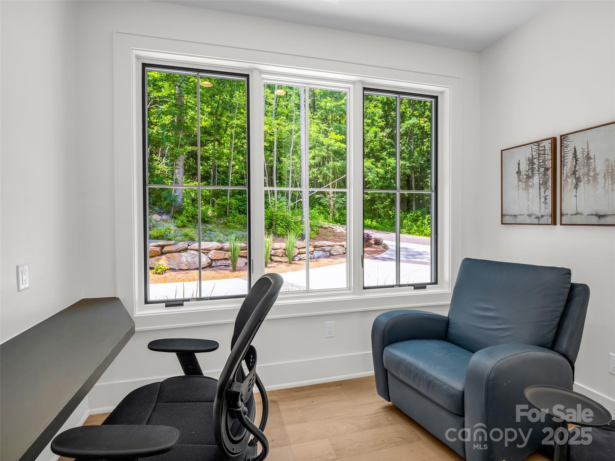 627 Cherry Hill, Unit 201 Mill Spring, NC 28756 - Photo 23 of 48 a living room with furniture and a window