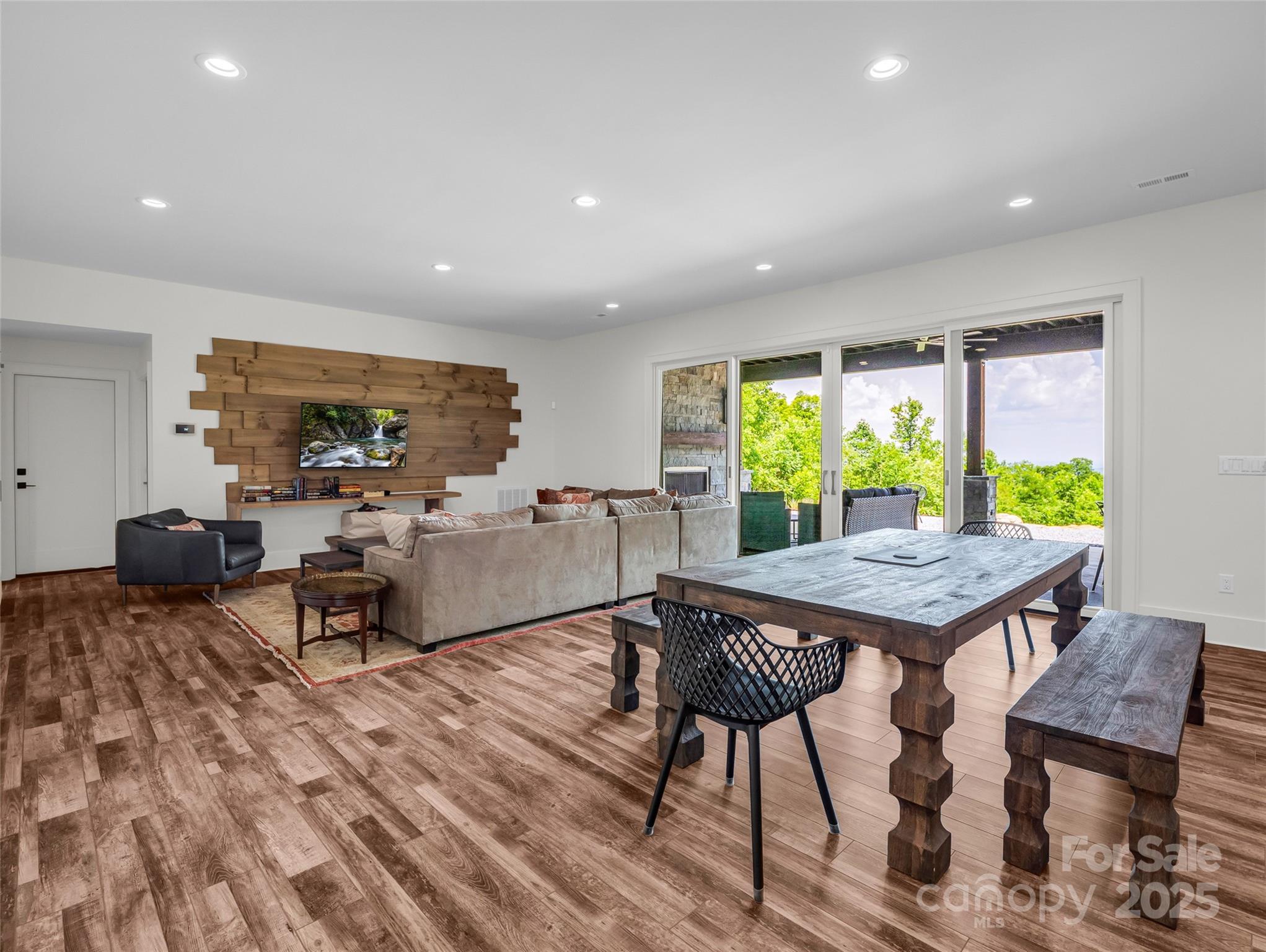 627 Cherry Hill, Unit 201 Mill Spring, NC 28756 - Photo 26 of 48 a living room with furniture a window and a table