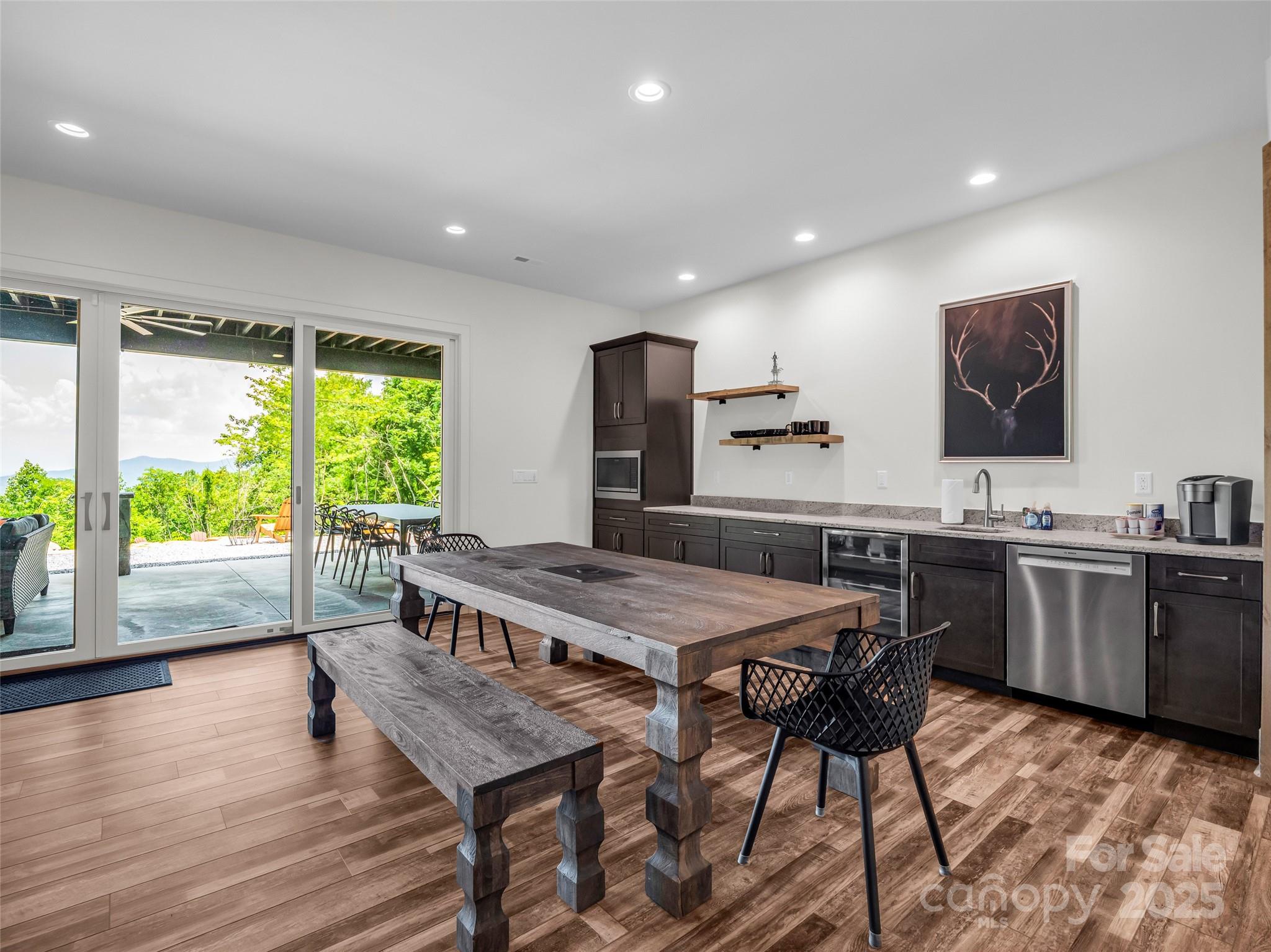 627 Cherry Hill, Unit 201 Mill Spring, NC 28756 - Photo 27 of 48 a view of a dining room with furniture window and wooden floor