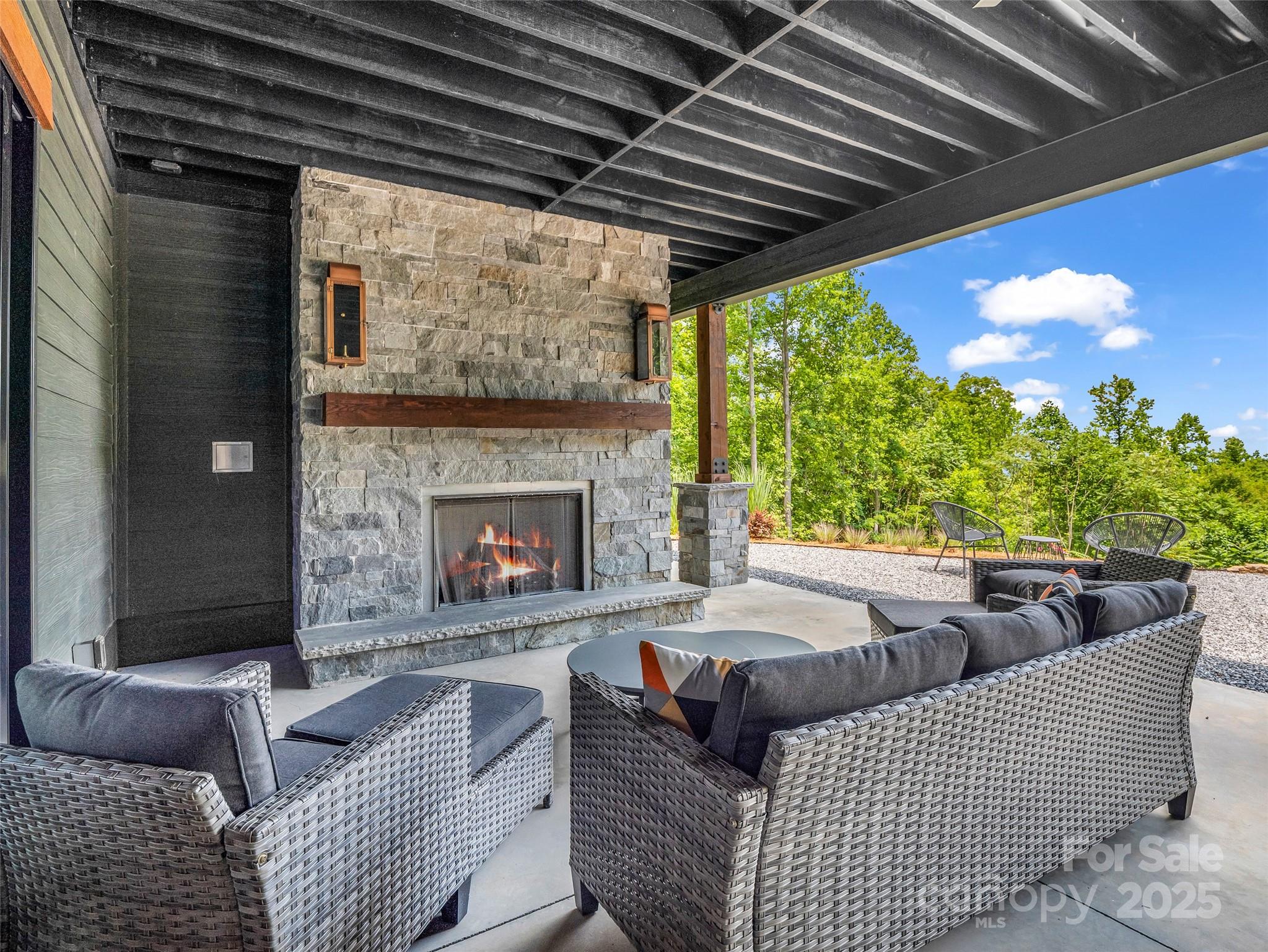 627 Cherry Hill, Unit 201 Mill Spring, NC 28756 - Photo 33 of 48 a living room with furniture and a fireplace