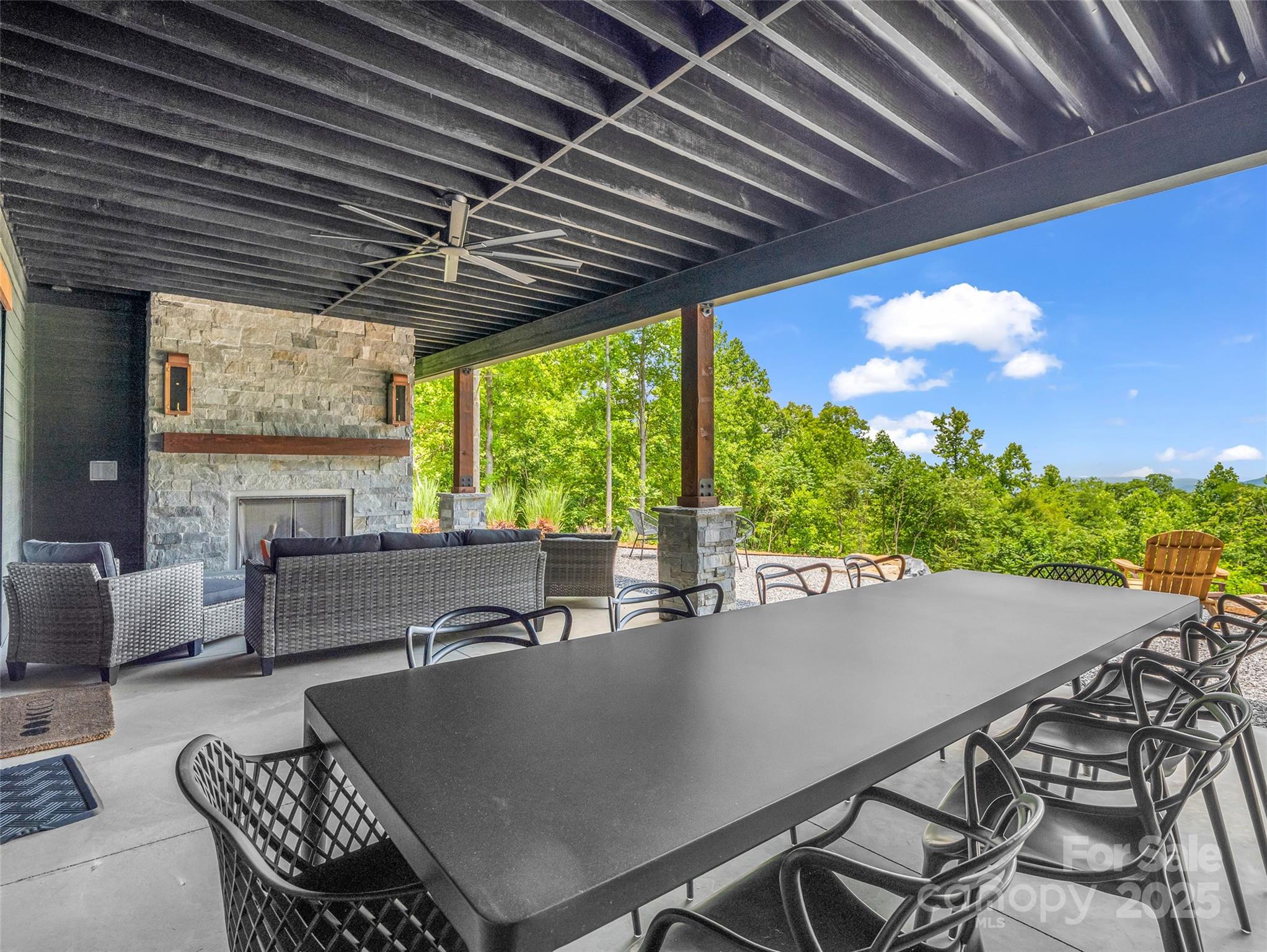 627 Cherry Hill, Unit 201 Mill Spring, NC 28756 - Photo 34 of 48 a view of a dining room with furniture window and outside view